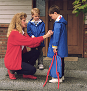 mother on porch with two sons